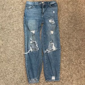 High waisted ripped blue jeans.